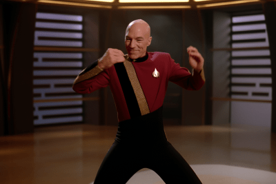 Captain Picard dancing energetically in a vibrant Star Trek scene