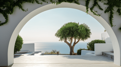 Mediterranean house archway overlooking green cliffs with olive trees