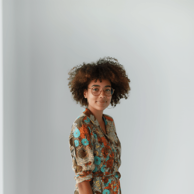Confident Woman with Afro Hair in Office