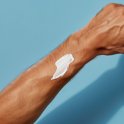 Minimalist White Skin Cream on Arm