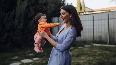 Mother and son playing in the garden