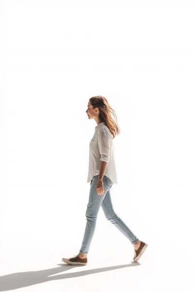 Stylish Woman Walking on White Background