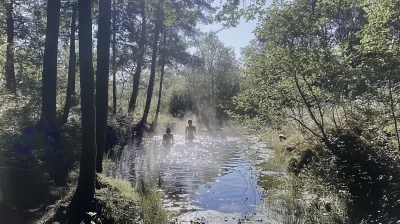 Vintage cinematic still with limestone miners in a lake