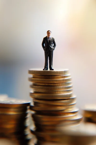 Miniature Businessman on Coins