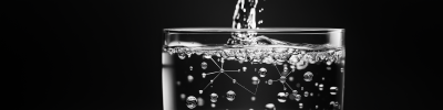 Overflowing Glass of Water with Connected Bubbles