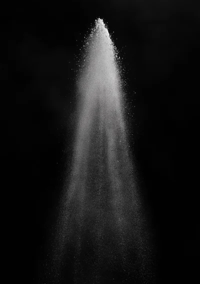 White Powder Spray on Black Background