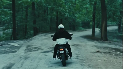 Man Riding Motorbike in Forest