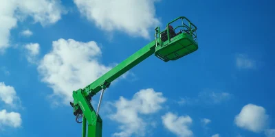 Boom Lift Against Clear Sky