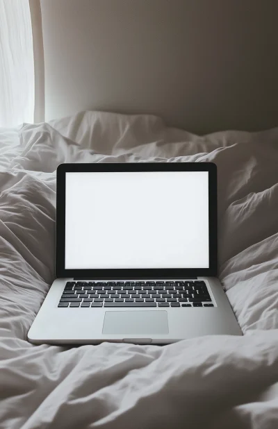 Open Laptop on Bed