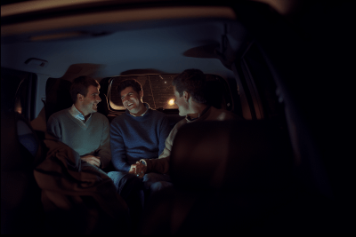 Friends in an SUV at Night