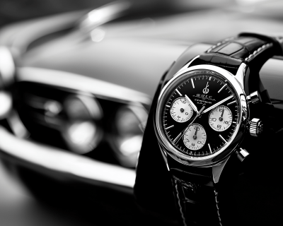 Luxury Watch and Car Advertisement