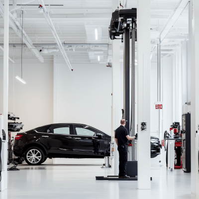 Technician Servicing Vehicle Lift