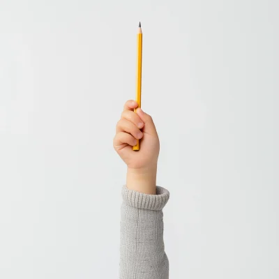 Child’s Hand Holding Pencil