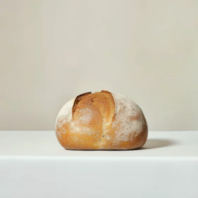 Loaf of Bread on White Backdrop