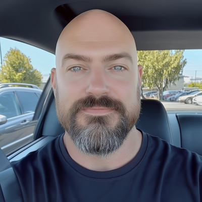 Smiling Bald Man in Car