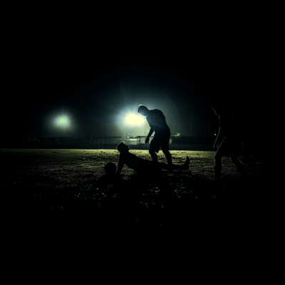 Soccer Players Helping Each Other