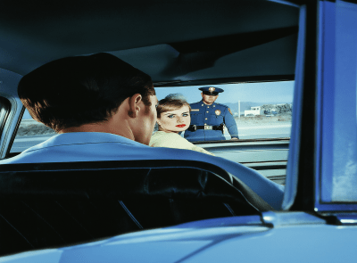 Woman in Car with Officer