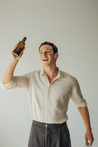 Excited Young Man with Bottle