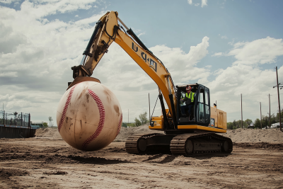 Excavator Batting a Giant Inflatable Baseball