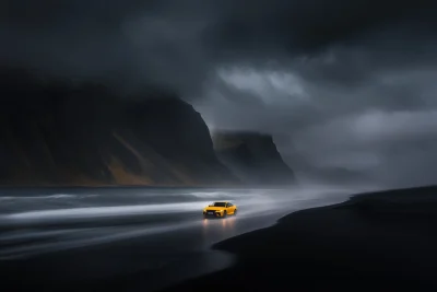 Yellow Car on Black Sand Beach